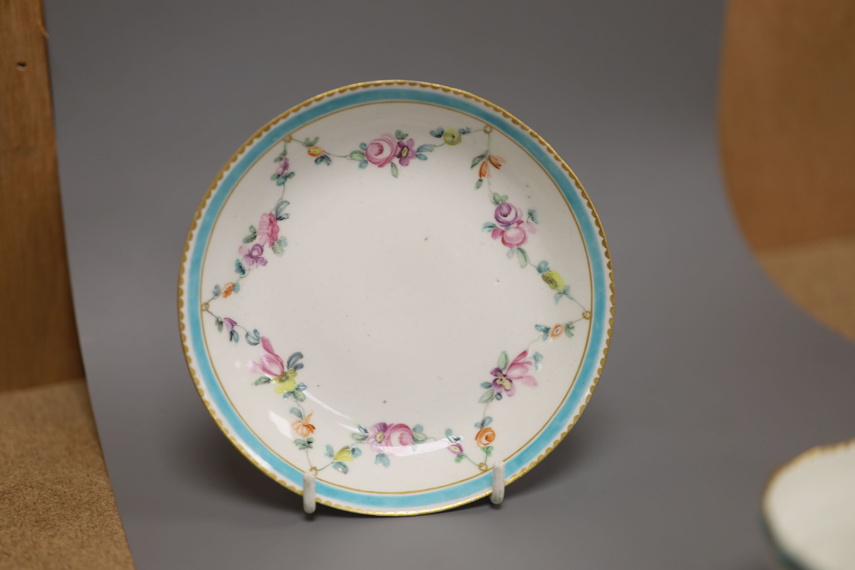 A Chelsea Derby teabowl and saucer painted with flowers, c.1778, blue Crown Derby mark with no batons, diameter 13cm